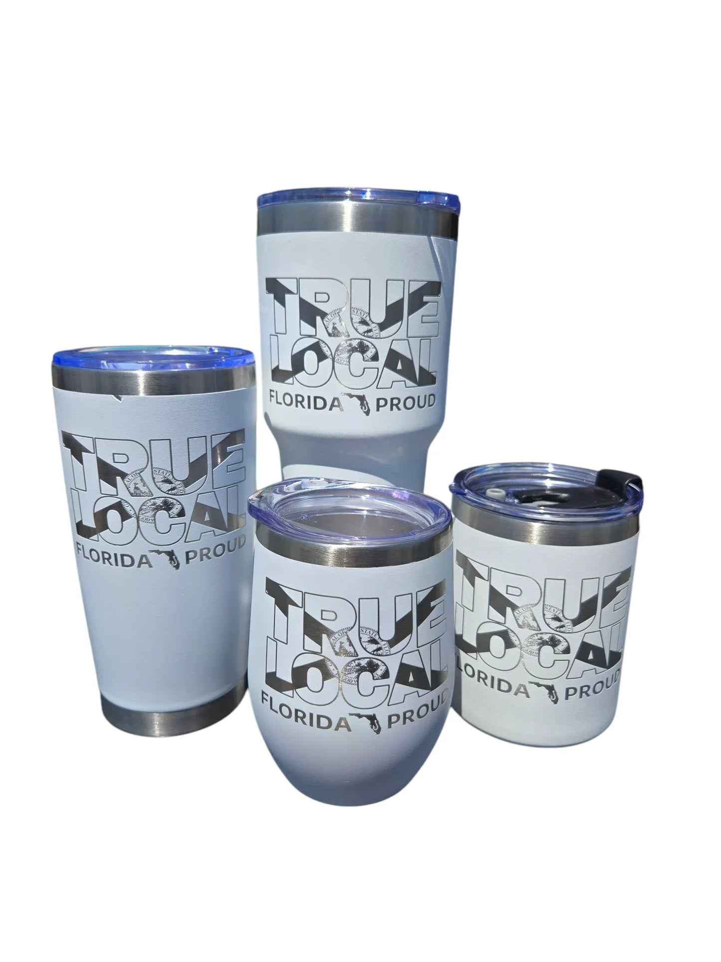 True Local Florida Proud insulated tumblers in assorted sizes with blue lids, showcasing local pride apparel