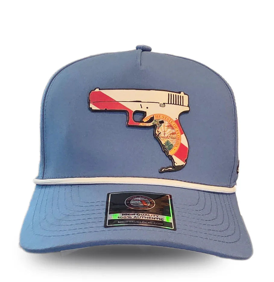 Blue trucker hat with Florida-shaped pistol graphic, red and white stripes, state seal detail