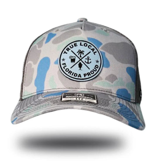 Florida Proud camo trucker hat with True Local patch, palm, anchor, fish design for local pride apparel