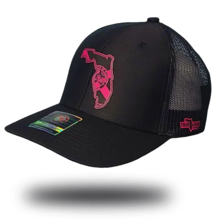 Florida Proud black trucker hat with neon pink leather patch – state outline snapback cap
