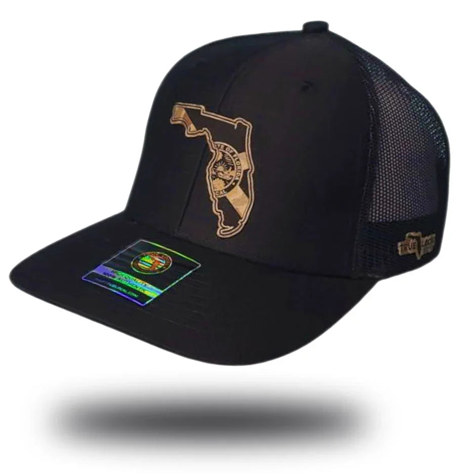 Florida Proud black hat with desert camo leather patch – state outline engraved trucker snapback