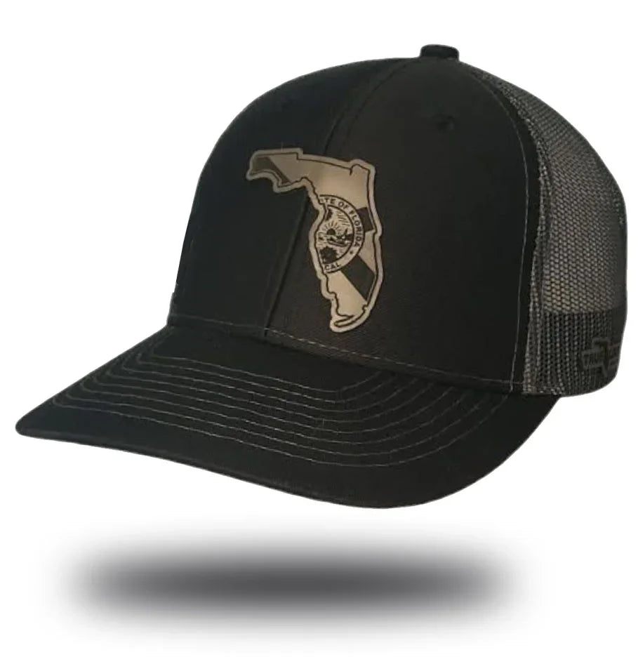 Florida Proud black trucker hat with slate grey leather patch – state outline engraved snapback