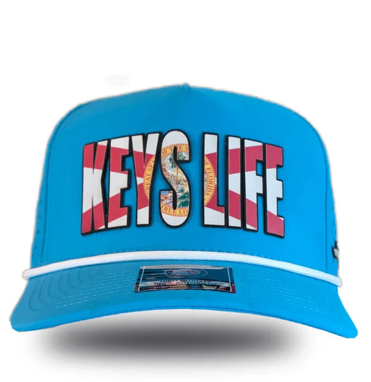 Bright blue trucker hat with 'KEYS LIFE' in Florida flag design, bold local pride apparel