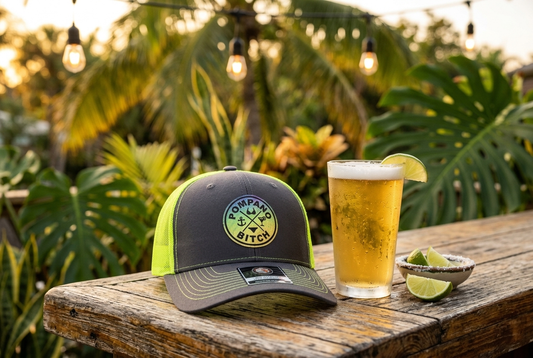 True Local neon trucker hat styled at outdoor bar with cold beer - how to style a trucker hat