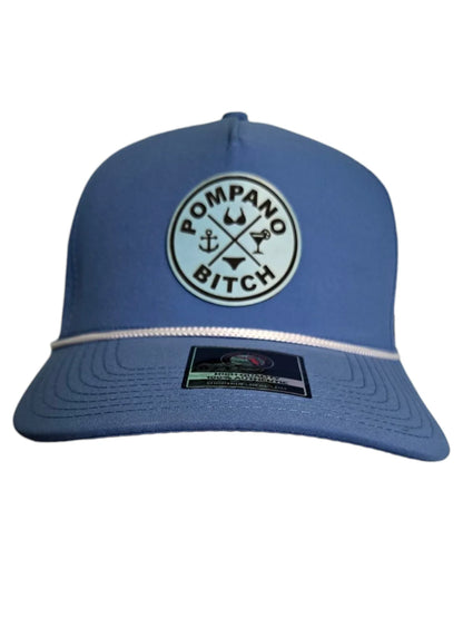 Blue Pompano Beach hat with anchor, bikini, and cocktail logo, bold local Florida apparel