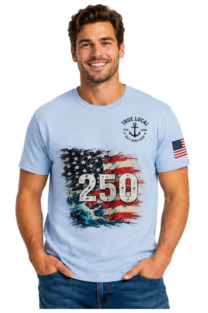 Men's light blue t-shirt with patriotic 250 design, American flag waves, anchor, and sleeve flag patch