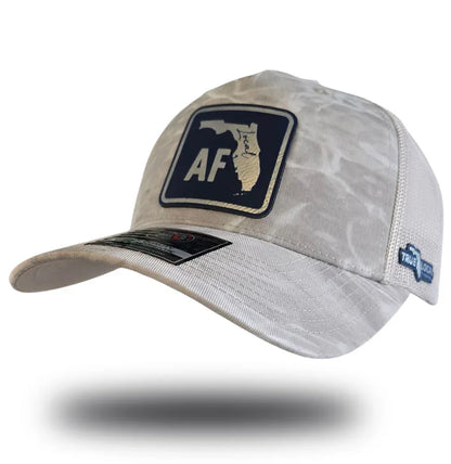 Beige camo trucker hat with Florida 'AF' patch, mesh back, and True Local logo, celebrating local Florida pride.