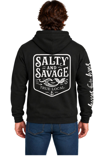 Black Salty and Savage hoodie sweatshirt back with shield badge, mermaid tail in waves, True Local text and anchor, Stay Salty sleeve