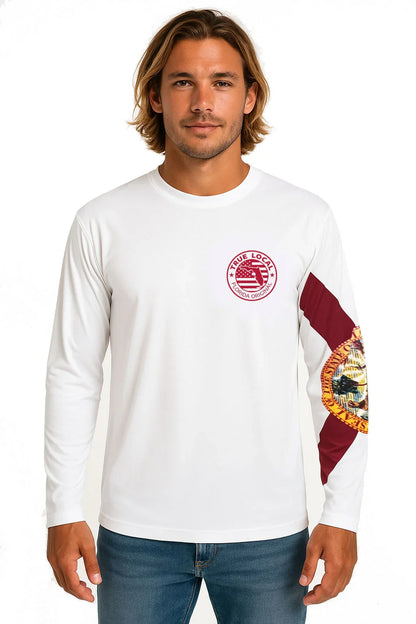 Man wearing white long sleeve shirt with Florida state seal graphic and 'True Local' chest logo