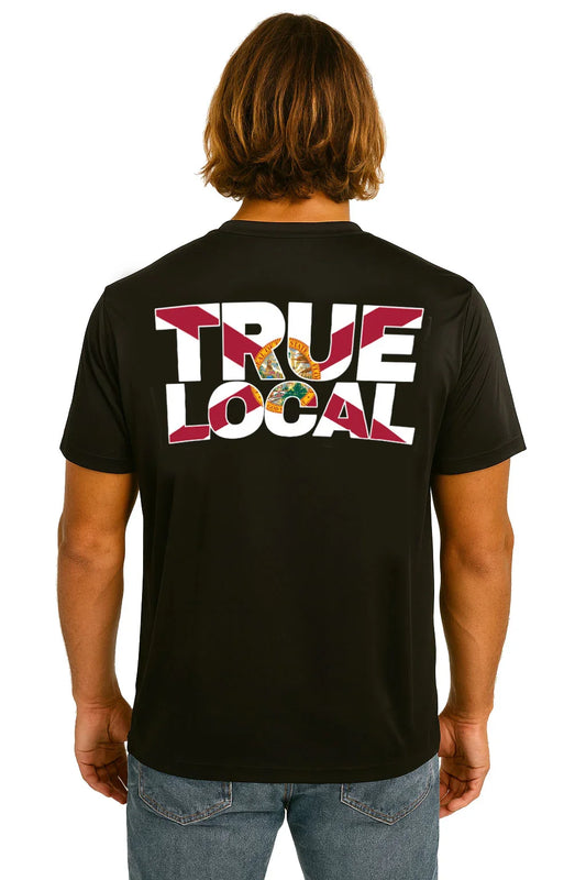 Black True Local t-shirt with bold graphic back print, worn by man with long hair, Florida pride apparel
