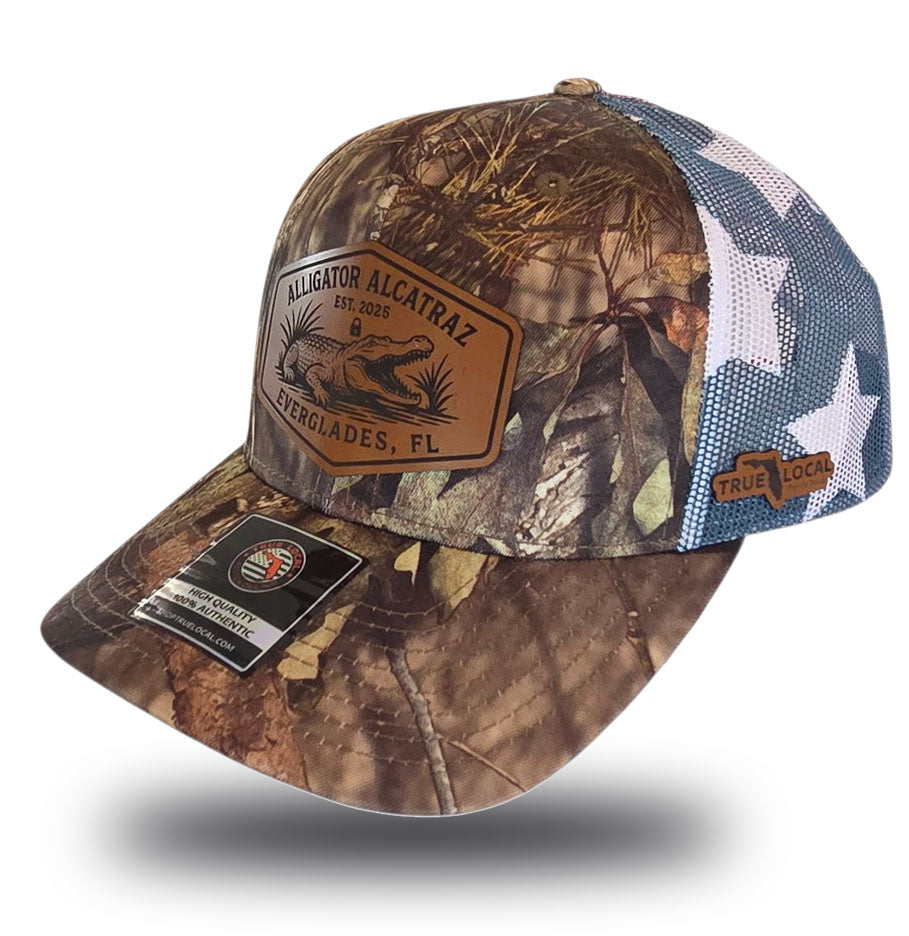 Alligator Alcatraz hat, Everglades trucker hat, Mossy Oak camo cap, stars and stripes hat, leather patch snapback, Florida fishing hat, patriotic trucker hat, camo hunting cap, outdoor adventure hat, True Local brand.