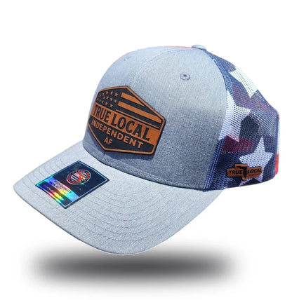 Gray True Local trucker hat with patriotic stars, 'Independent AF' patch, and mesh back for Florida pride