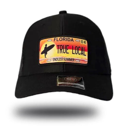 Black cap with Florida 'True Local' license plate patch, surfer silhouette, endless summer design