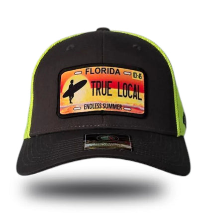 Black and neon green trucker hat with Florida 'True Local Endless Summer' surf patch, perfect for beach vibes.