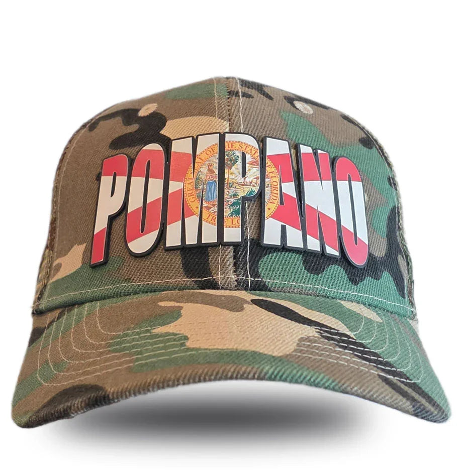 Camouflage trucker hat with 'Pompano' in red and white stripes and Florida state seal, celebrating local Florida pride.