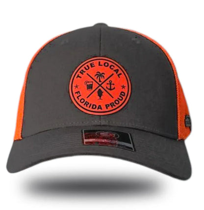 Gray and orange trucker hat with 'True Local Florida Proud' patch featuring palm, anchor, and fish icons