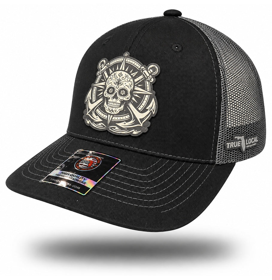 Black and Gray Sugar Skull Anchor Trucker Hat, bill pointing left with side panels and True Local embroidery