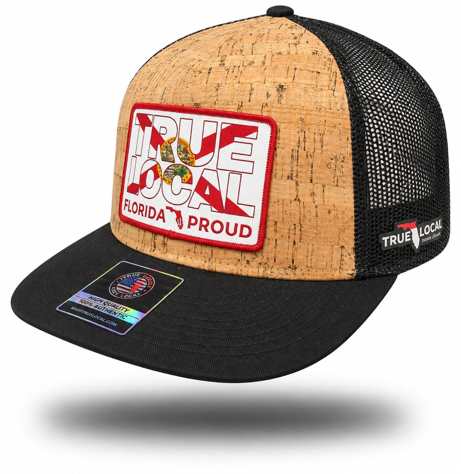 Black Florida Proud cork-finish trucker snapback hat with bill pointing left, tan textured front, red-bordered Florida flag patch and black mesh