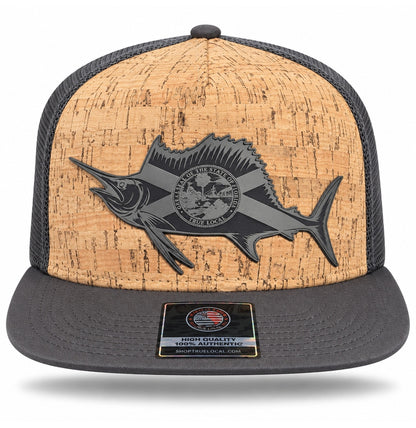 Front of charcoal sailfish cork-finish snapback hat showing Florida flag fish patch, tan textured front and short wide gray flat brim