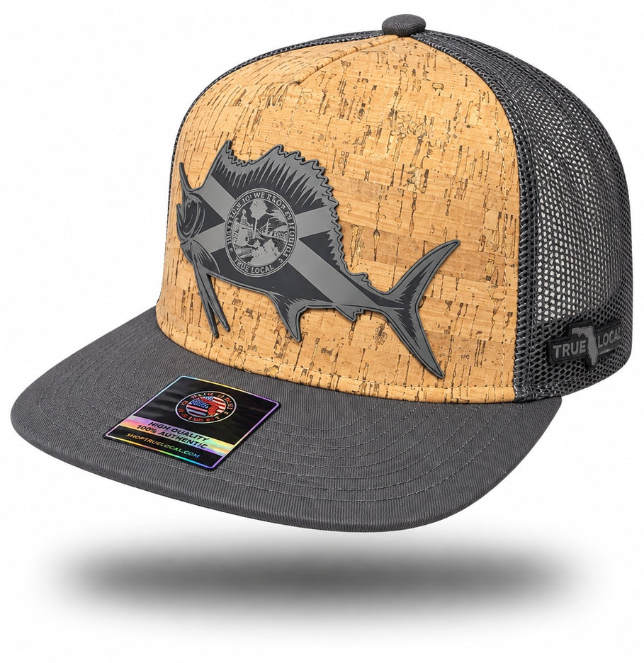 Charcoal Florida flag sailfish cork-finish snapback hat with bill pointing left, tan textured front, dark die-cut fish patch and charcoal mesh