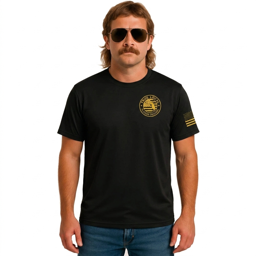 True Local Florida Man T-Shirt in black with gold chest logo and American flag sleeve detail, front view