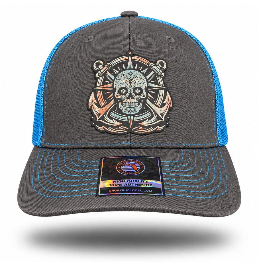 Gray and Blue Sugar Skull Anchor Trucker Hat, front view showing sugar skull compass and twin-anchor patch