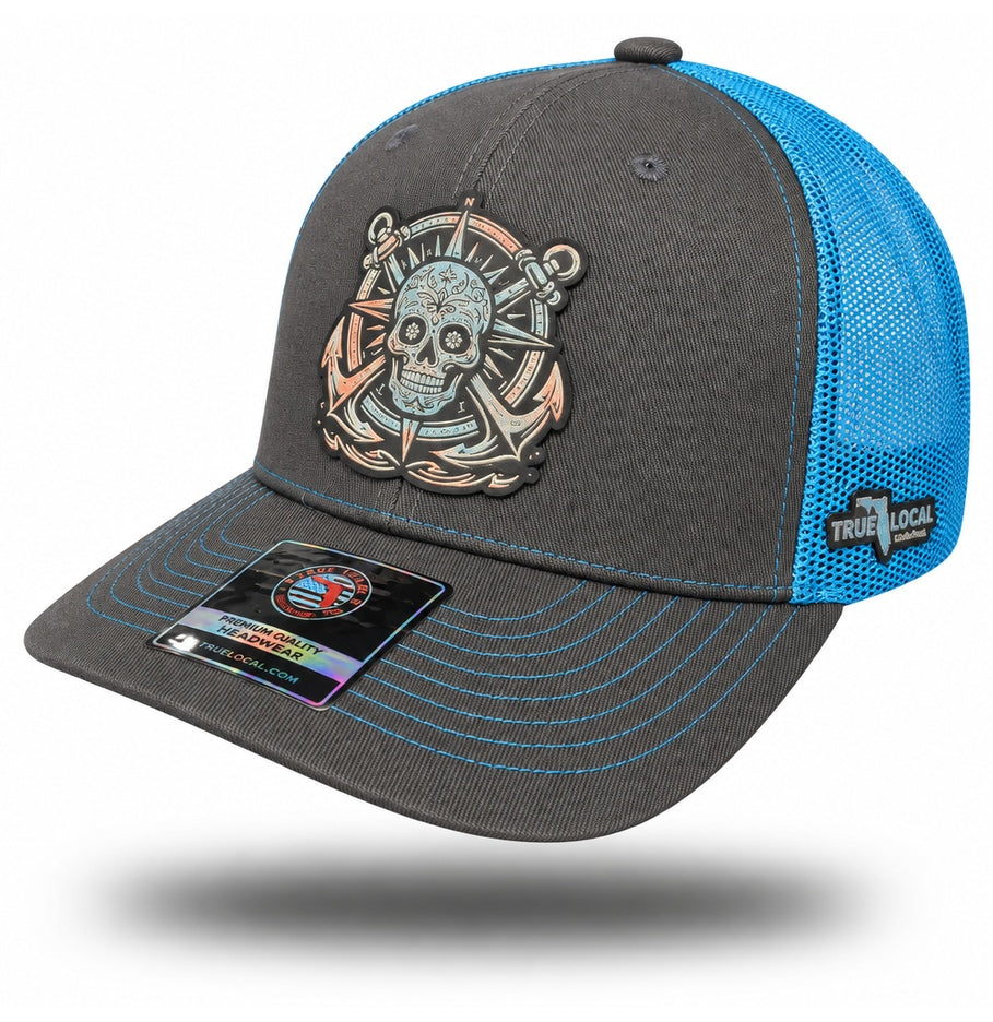 Gray and Blue Sugar Skull Anchor Trucker Hat, bill pointing left with side panels and True Local embroidery