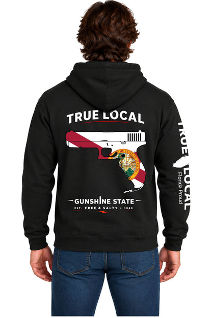 Black Gunshine State hoodie sweatshirt back with Florida state flag pistol, Florida-shaped grip, True Local and Gunshine State Est. Free and Salty 1845 text