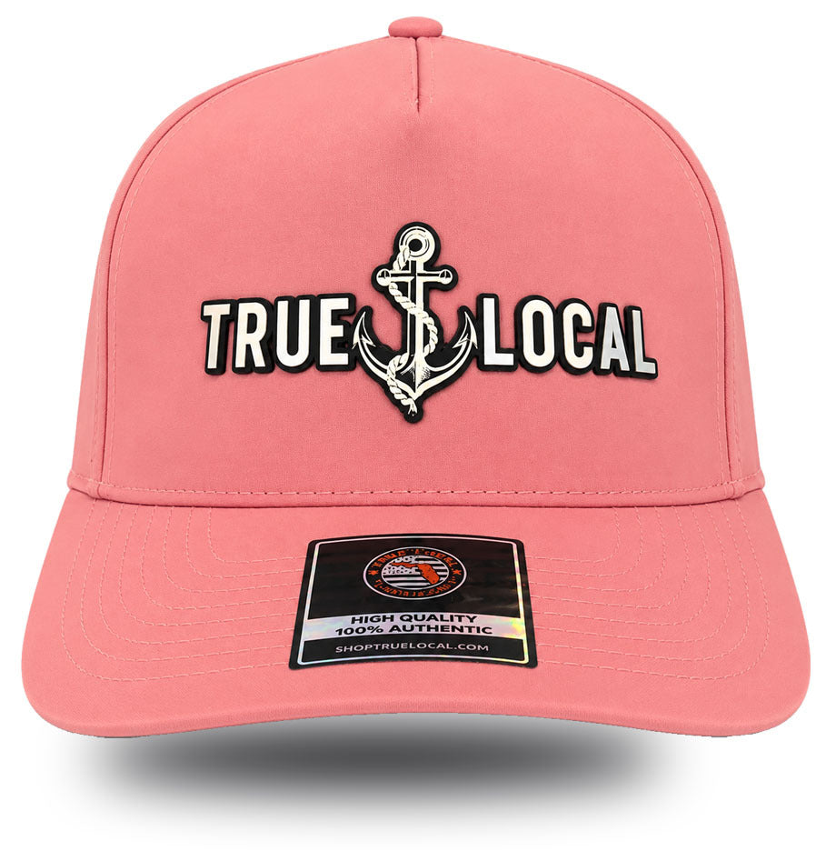 True Local women's anchor performance hat in Sea Hibiscus coral with iridescent holographic patch front view