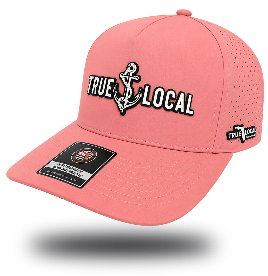 True Local women's anchor performance hat in Sea Hibiscus coral with iridescent patch side angle view