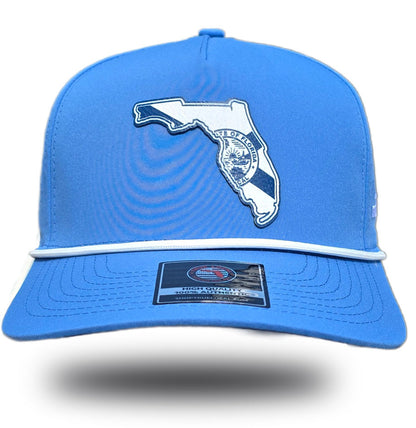 White Florida state flag patch with state seal on sky blue performance rope hat, front view
