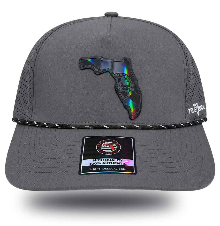 Black holographic Florida state seal patch on gun gray Darkwater Glow performance rope hat, front view